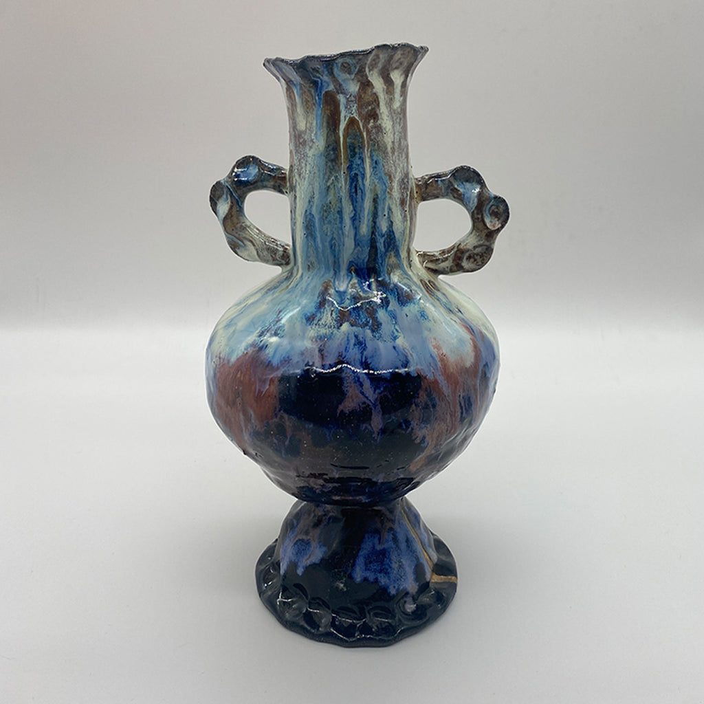 Tall vase with decorative handles