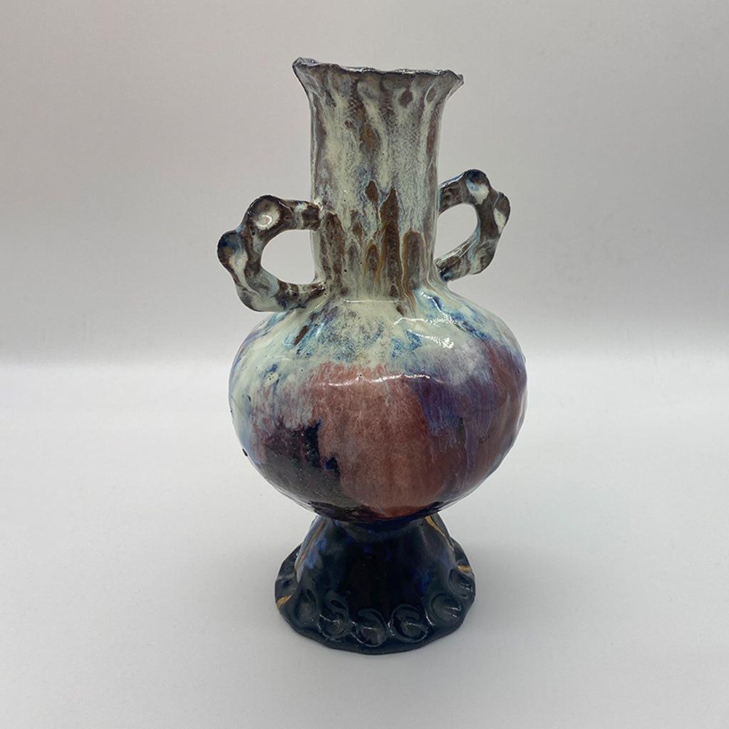 Tall vase with decorative handles